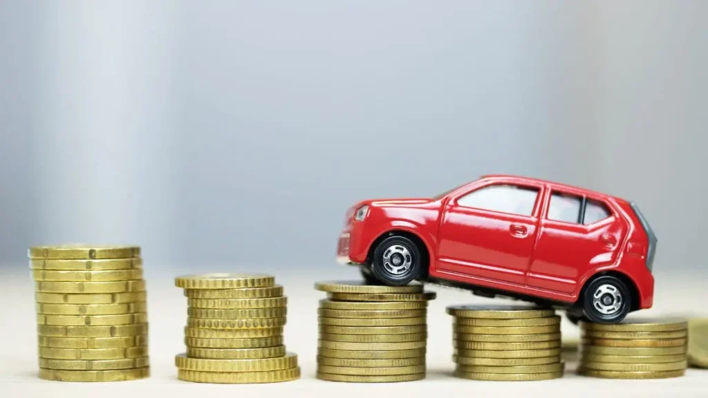 Toy Car On Top Of Stacks Of Coins