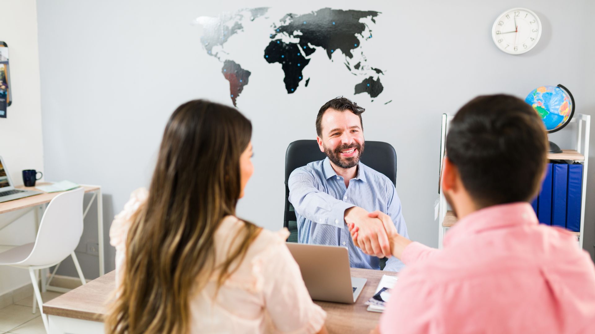 Insurance Advisor Meeting With Clients In Marietta Office